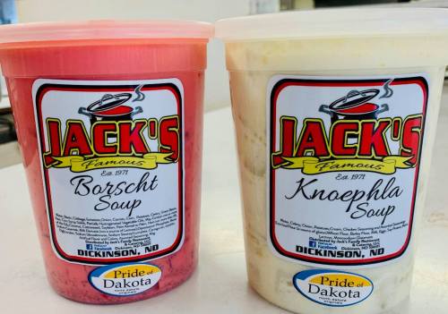 Two containers of Jack's Famous Soup: one red Borscht and one creamy Knoephla, both labeled with "Pride of Dakota."