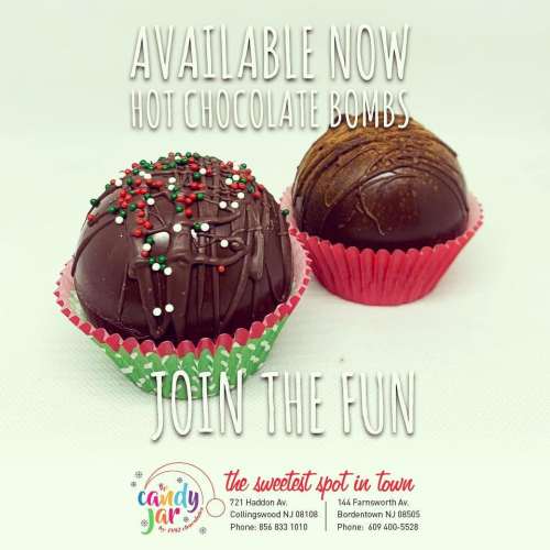 Two decorated hot chocolate bombs in festive wrappers, with text promoting their availability and inviting customers to join the fun.