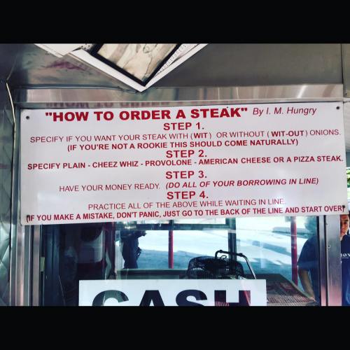 Sign with instructions on how to order a steak, detailing steps for customization and ordering process.