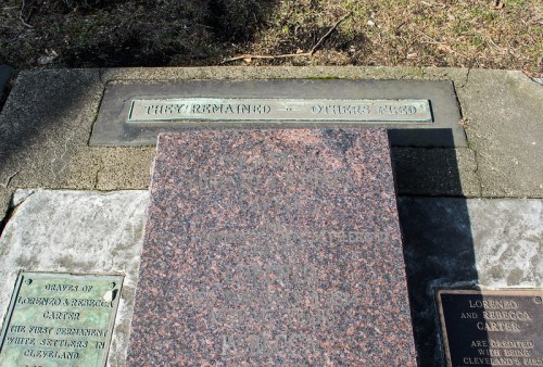 Gravestones with inscriptions, including "They remained - others fled," in a cemetery setting.