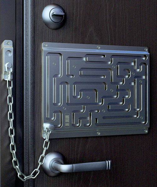 A unique door lock featuring a maze design, with a chain and handle on a dark wooden door.