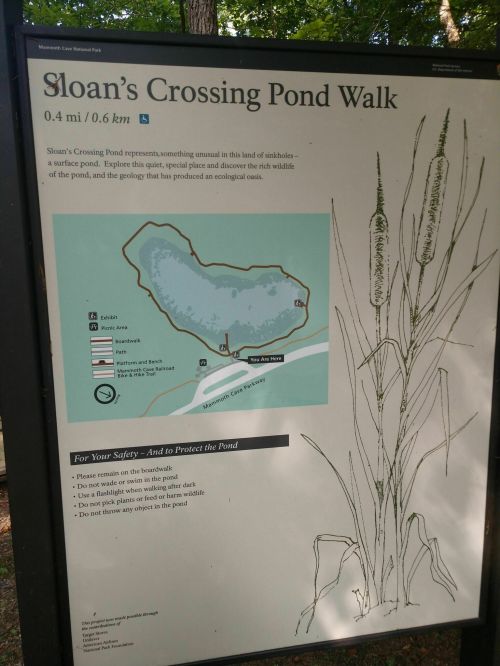Sign for Sloan's Crossing Pond Walk, detailing the area, wildlife, and safety guidelines for visitors.