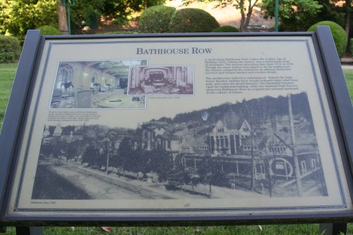 Sign about Bathhouse Row, featuring historical photos and information about its significance in the Gilded Age.