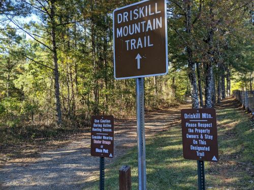 Signage at the Driskill Mountain Trail entrance, with warnings about hunting season and respect for property owners.