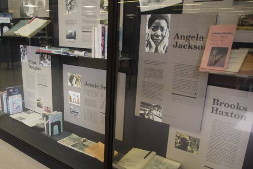 Display case featuring biographies and works of authors Angela Jackson, Ellen Douglas, Jessie Scott, and Brooks Haxton.
