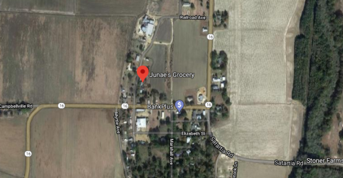 Map showing Junae's Grocery and nearby locations, including BankPlus, roads, and fields in a rural area.