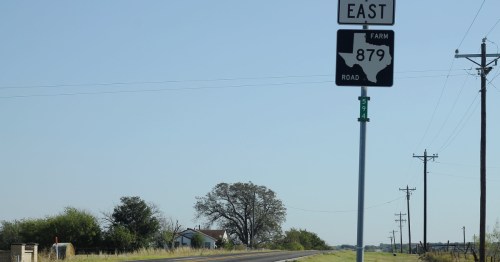 road sign for farm road 879 east near garrett texas