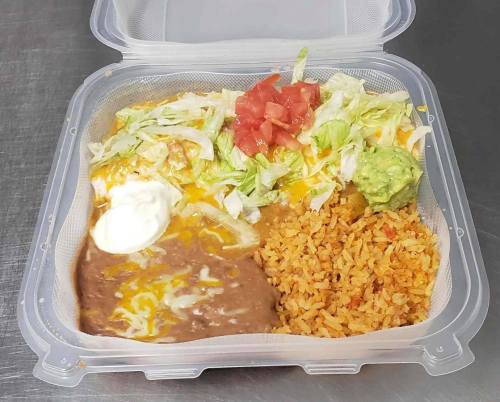 A takeout container with rice, refried beans, lettuce, tomatoes, cheese, guacamole, and sour cream.