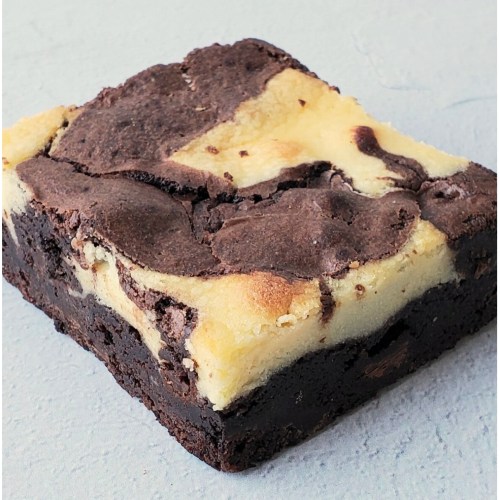 A close-up of a marbled brownie with a rich chocolate and creamy cheesecake swirl on a light background.