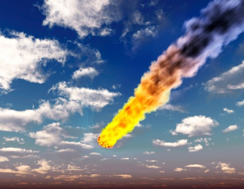 A fiery meteor streaks through a blue sky filled with fluffy clouds, leaving a trail of smoke behind.