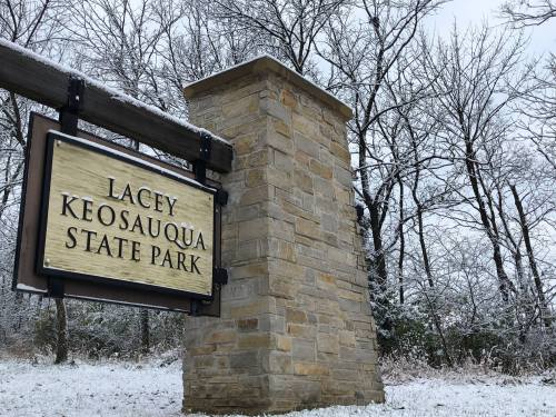 Sign for Lacey Keosauqua State Park surrounded by snow-covered trees.