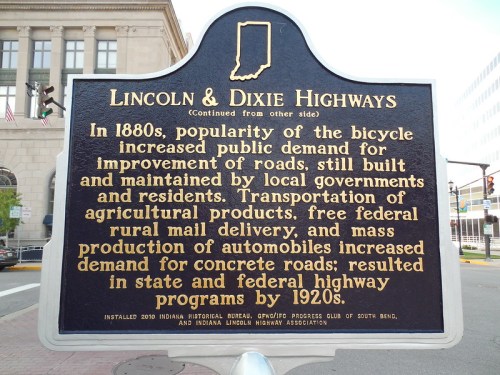 Sign detailing the history of Lincoln and Dixie Highways, highlighting their impact on local infrastructure and agriculture.