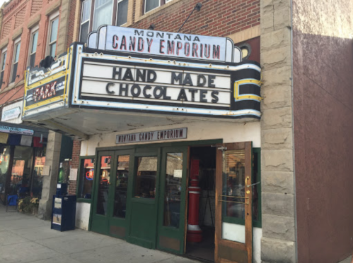 Exterior of Montana Candy Emporium with a marquee advertising handmade chocolates.