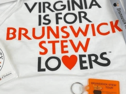 White t-shirt with the text "Virginia is for Brunswick Stew Lovers" in bold red and black letters.