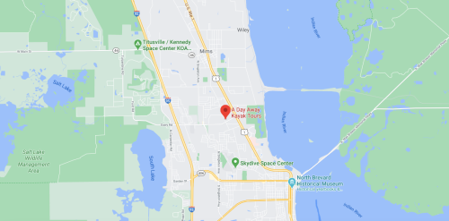 Map showing the location of "A Day Away Kayak Tours" in Titusville, Florida, near Kennedy Space Center and local parks.