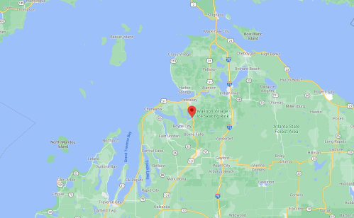 Map showing a location marked with a red pin in northern Michigan, near Lake Michigan and surrounding areas.