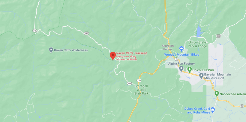 Map showing Raven Cliffs Trailhead location, hiking area near a stream with waterfalls, surrounded by green wilderness.
