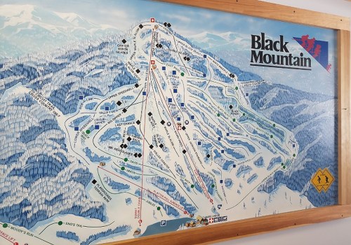 Map of Black Mountain ski resort, showing trails, lifts, and facilities in a snowy landscape.