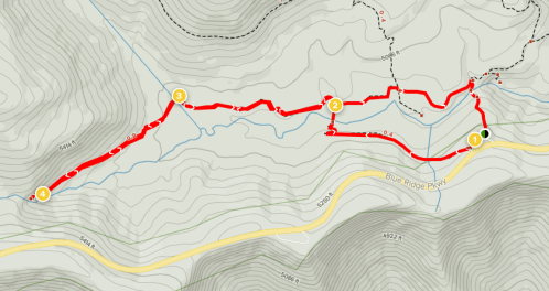 Map showing a hiking trail with marked waypoints and elevation contours in a mountainous area.