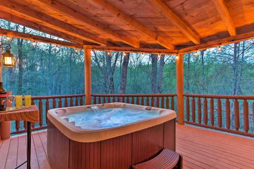 A cozy wooden deck with a hot tub, surrounded by trees and soft lighting, creating a relaxing outdoor atmosphere.