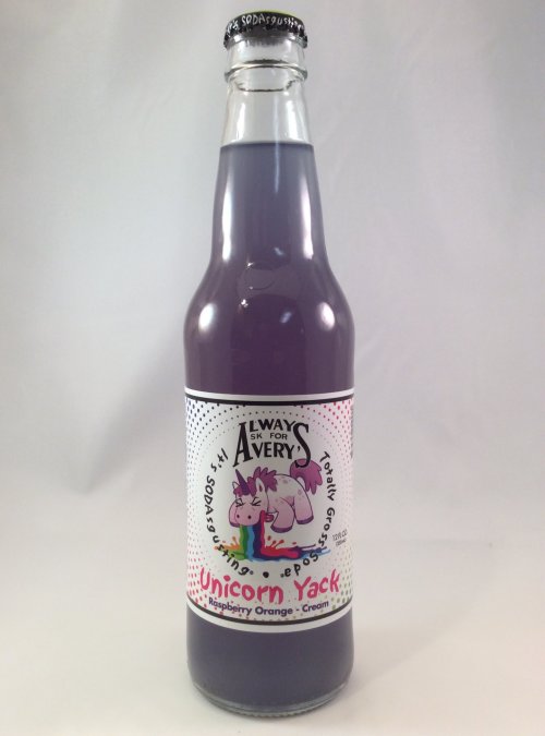 A bottle of "Unicorn Yack" soda, featuring a purple drink and a playful label with a cartoon unicorn.