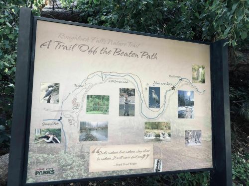 Sign for Roughrock Falls Nature Trail, featuring a map and images of the trail, with a quote by Frank Lloyd Wright.