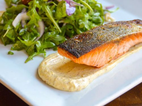 Abstract image featuring a textured, muted background with subtle variations in color and light.