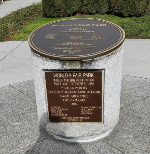 Plaque at World's Fair Park in Knoxville, detailing its history and renovation, with visitor statistics and opening date.