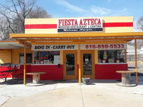 Exterior of Fiesta Azteca Mexican Restaurant, featuring a colorful facade and outdoor seating area.