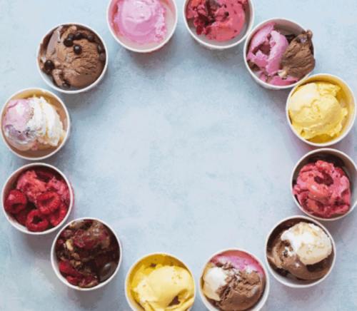A circular arrangement of colorful ice cream cups in various flavors on a light background.