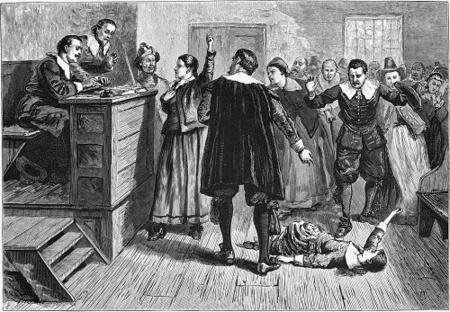 A historical courtroom scene depicting a trial, with a woman pointing and a man lying on the floor.