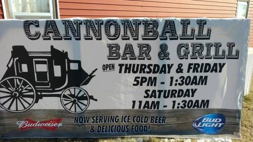 Sign for Cannonball Bar & Grill, open Thursday to Saturday, featuring Budweiser and Bud Light, serving cold beer and food.