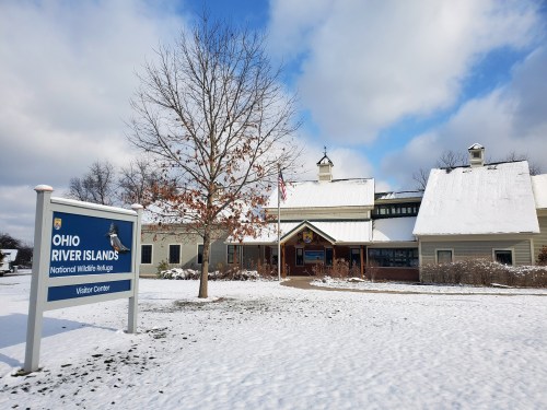 Visitor center of Ohio River Islands National Wildlife Refuge, surrounded by snow and a clear blue sky.