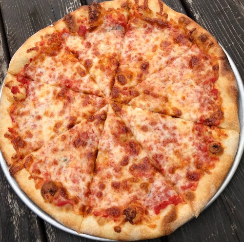 A large, round cheese pizza with golden crust and melted cheese, sliced into equal triangular pieces.
