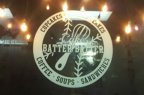 Logo of "Cake Batter" featuring a whisk, surrounded by text about cupcakes, cookies, cakes, coffee, soups, and sandwiches.