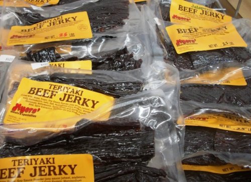 Packages of teriyaki and jalapeño beef jerky, labeled and stacked together.