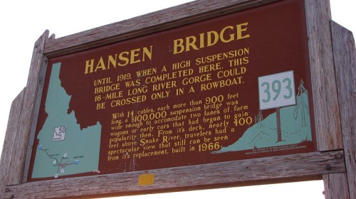 Sign about Hansen Bridge, detailing its history and specifications, including its height and construction date.