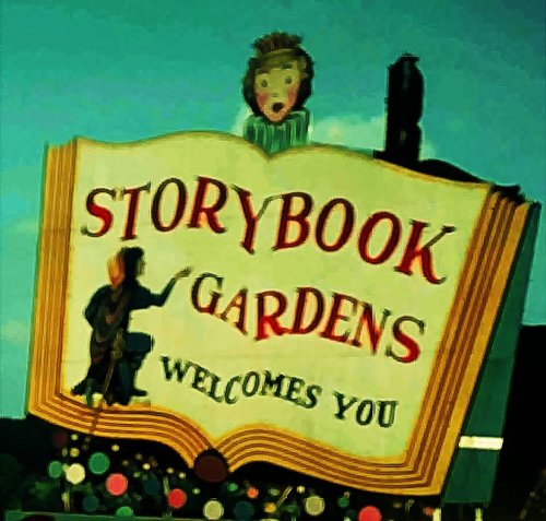 Colorful sign for Storybook Gardens featuring an open book and whimsical characters, welcoming visitors.
