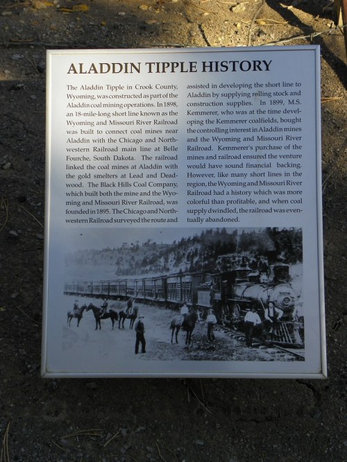 Sign detailing the history of the Aladdin Tipple in Crook County, Wyoming, and its connection to local railroads.