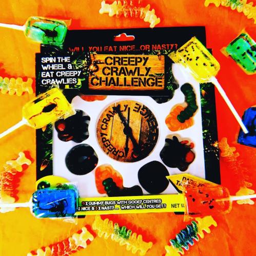 Colorful packaging for the "Creepy Crawly Challenge" game, featuring gummy bugs and a spinning wheel.