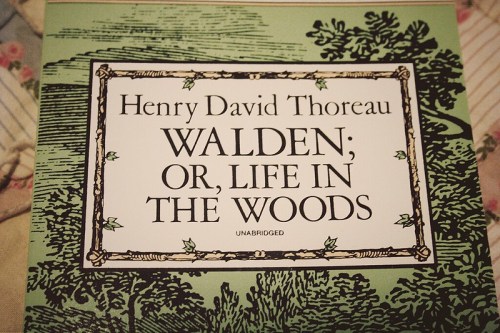 Cover of "Walden; or, Life in the Woods" by Henry David Thoreau, featuring a green background and decorative border.