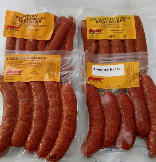 Four packages of sausages: Cheddar Brats, Smoked Jalapeno Bratwurst, Country Brats, and Old Fashioned Wieners.