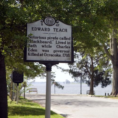 Historical marker about Edward Teach, known as Blackbeard, detailing his life and death in 1718 near Ocracoke.