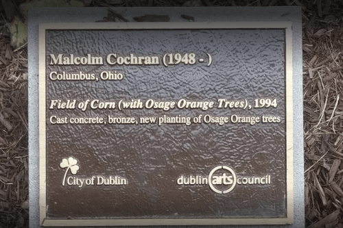 Plaque for "Field of Corn (with Osage Orange Trees)" by Malcolm Cochran, 1994, in Dublin, Ohio.