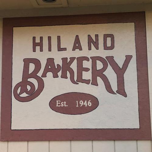 Sign for Hiland Bakery, featuring bold lettering and the establishment year 1946.
