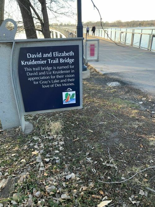 Sign for David and Elizabeth Kruidenier Trail Bridge, honoring their vision for Gray's Lake and love for Des Moines.