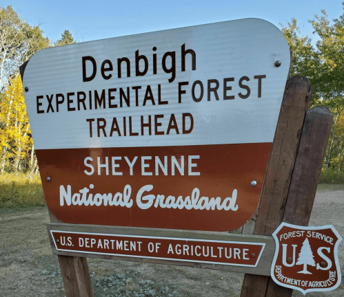 Sign for Denbigh Experimental Forest Trailhead in the Cheyenne National Grassland, U.S. Department of Agriculture.