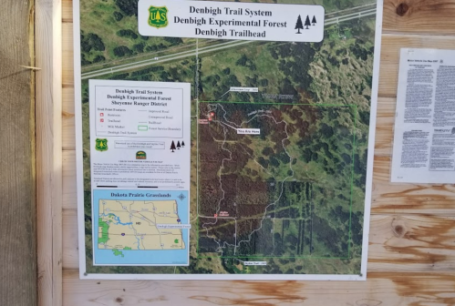 Map of the Denbigh Trail System in the Denbigh Experimental Forest, showing trails and surrounding areas.