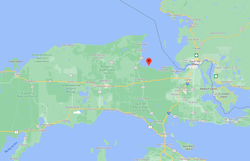 Map showing the northern part of Michigan, highlighting the area around Sault Ste. Marie and nearby natural features.