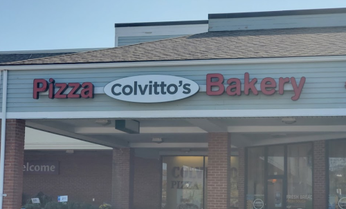 Sign for "Colvitto's Bakery" with "Pizza" prominently displayed, located on a storefront.